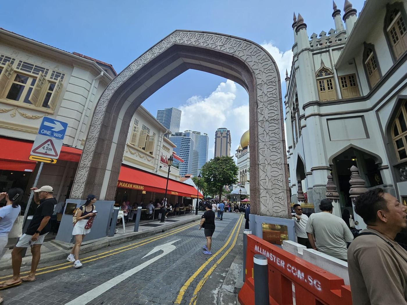 The ornamental gateway arch on Muscat Street, Kampong Glam, with Sultan Mosque beyond