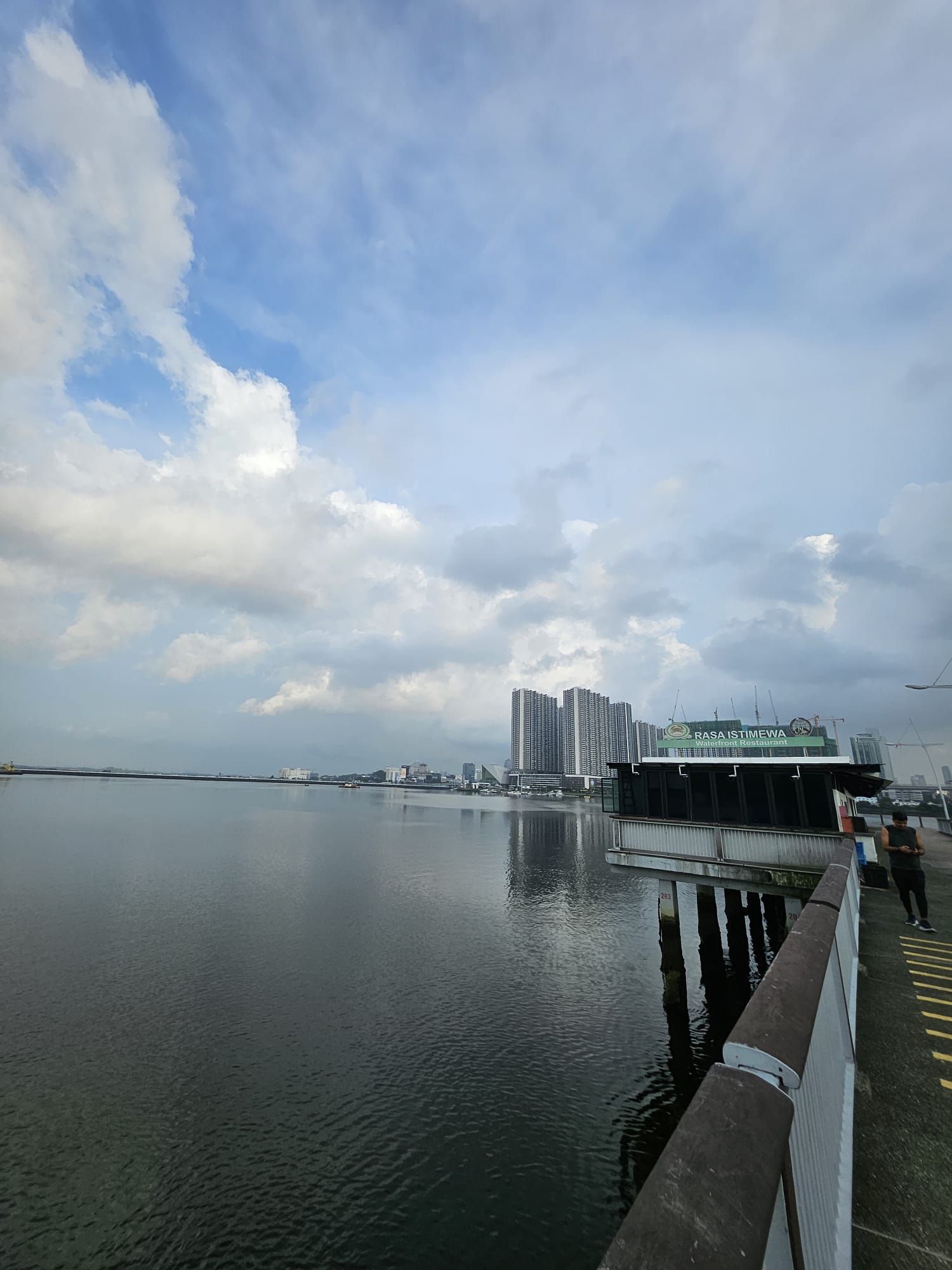 Woodlands Waterfront jetty with Rasa Istimewa restaurant and Johor Bahru's skyline across the Strait of Johor
